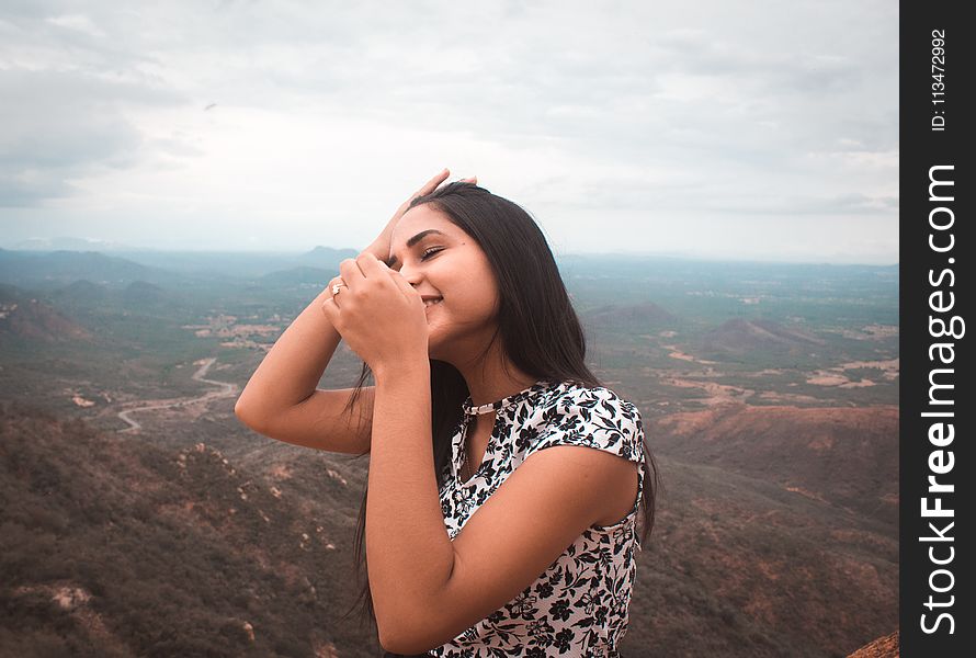 Woman Standing Peak Of Mountain