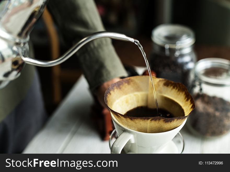 Shallow Focus Photography of Kettle Pouring Water on Coffee Filter