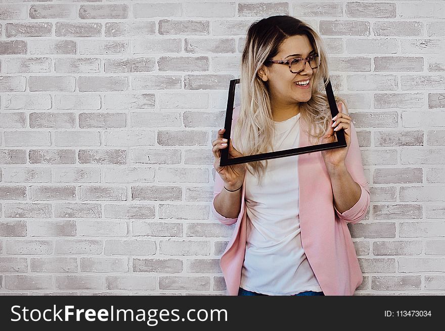 Woman Holding Black Photo Frame