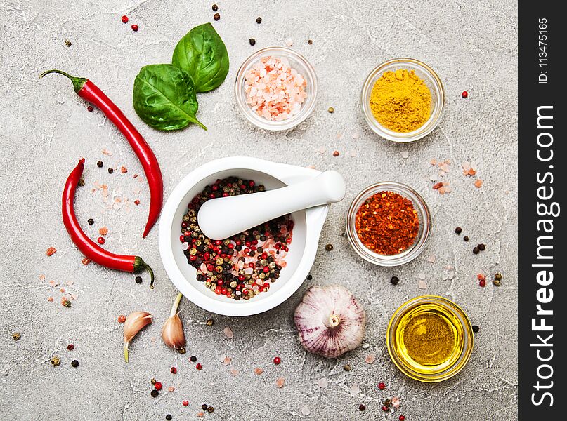 Different kind of spices on a stone background