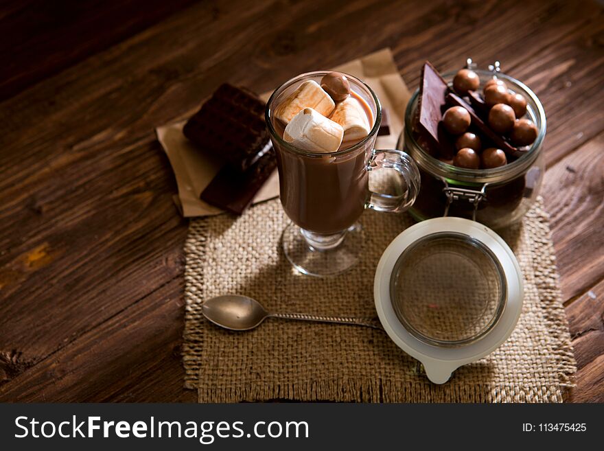 Homemade brown sweet chocolate cocktail on wooden table