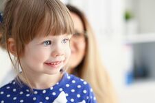Little Child With Mother At Pediatrician Reception Stock Photo