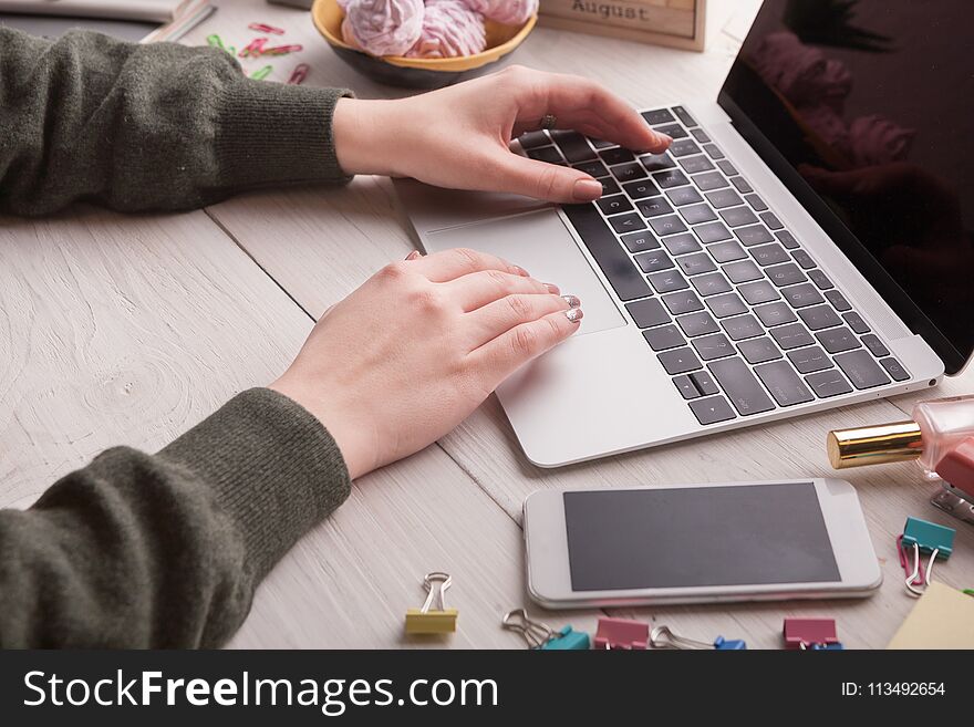 Closeup Of Female Hands Typing On Laptop Keyboard