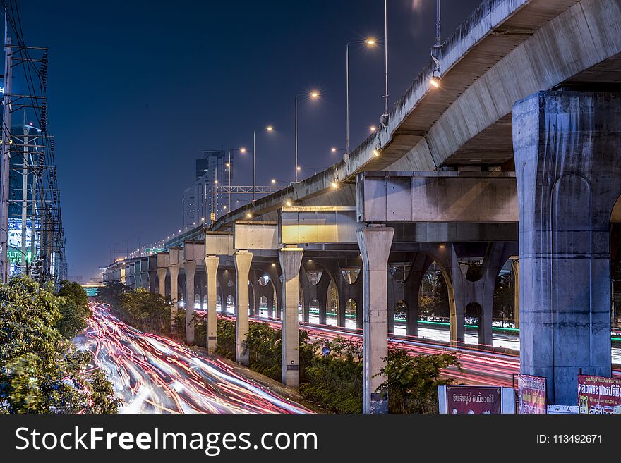 This photo was taken on a bridge at Bangna-Trad main road, Bangkok. The volume of cars and heavy congestion created the messy light trails created by the head and tail light of the vehicles. This photo was taken on a bridge at Bangna-Trad main road, Bangkok. The volume of cars and heavy congestion created the messy light trails created by the head and tail light of the vehicles.