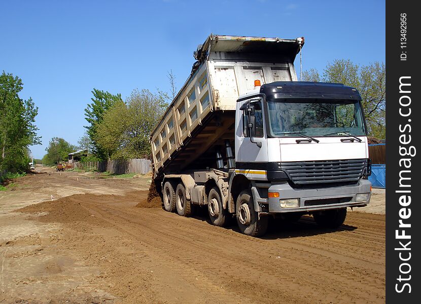 Truck dumper on construction site. Truck dumper on construction site