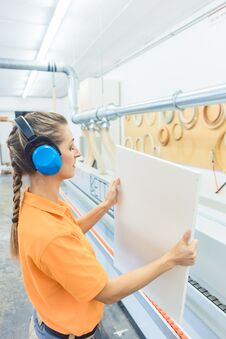Woman Carpenter Working In Furniture Factory Royalty Free Stock Image