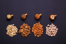 Assortment Of Nuts On A Black Background - Healthy Snack. Royalty Free Stock Photography