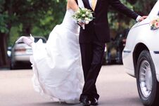 Bride And Groom Near White Limousine, Joyful Stock Images
