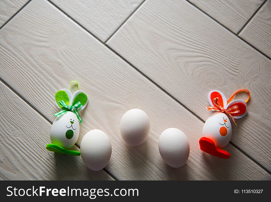 Easter eggs on wooden background. Happy Easter. Creative photo with easter eggs.Easter eggs on wooden background.Happy Easter.