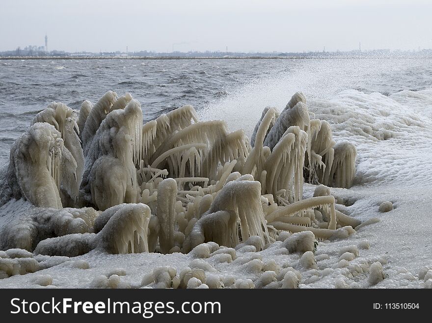 Icicles on the bank of a lake in the winter. Icicles on the bank of a lake in the winter