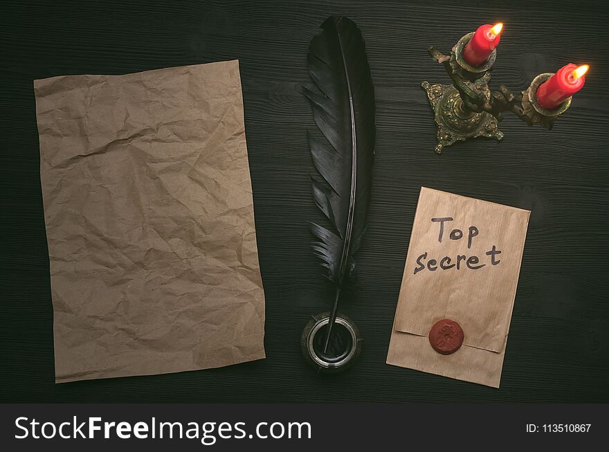 Top secret message document. Forbidden information. Detective agent desk table concept background. Top secret message document. Forbidden information. Detective agent desk table concept background.