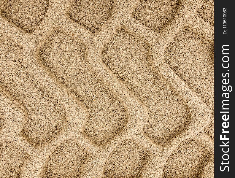 Big heavy tyre tracks embedded in sand. Big heavy tyre tracks embedded in sand