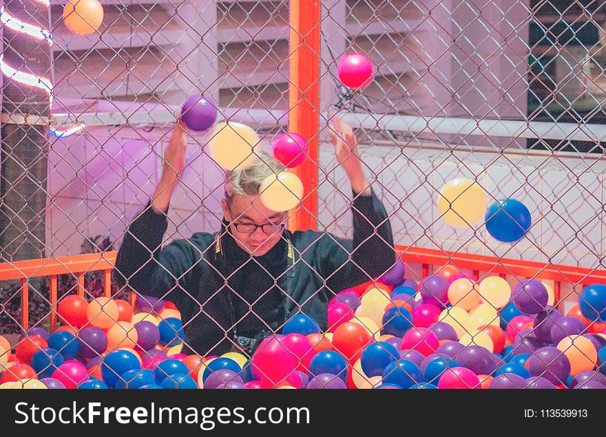 Man in Ball Pit
