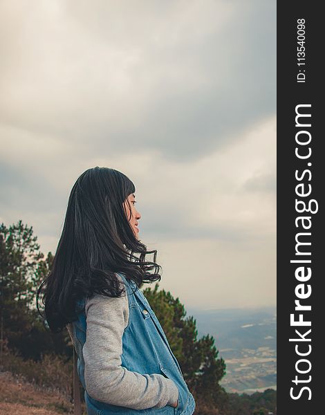 Woman In Gray And Blue Jacket