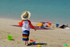Two Year Old Toddler Playing On Beach Stock Image
