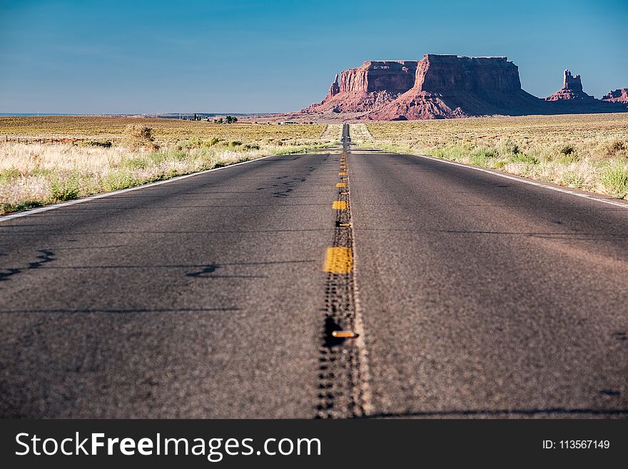 Empty scenic highway in Monument Valley, Arizona, USA