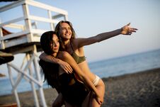 Young Women Having Fun On The Beach Royalty Free Stock Photos
