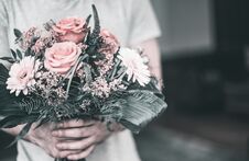 Beautiful Festive Pink Bouquet In Male Hands On The Background Of The Living Room Royalty Free Stock Image