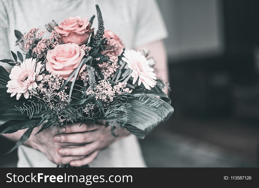 Beautiful Festive Pink Bouquet In Male Hands On The Background Of The Living Room