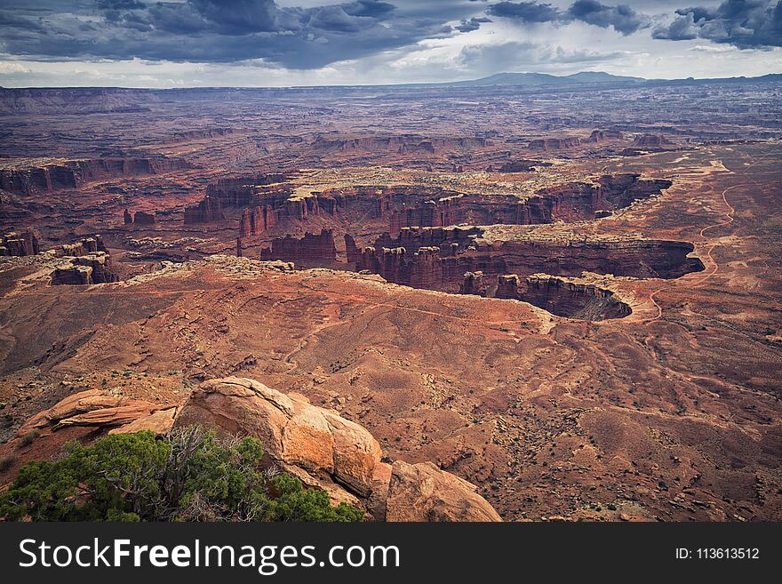 Canyonlands National Park erosion structure with clouds on sky, Utah, USA