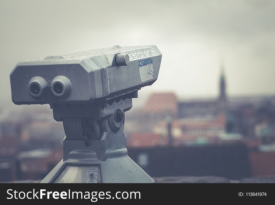 Gray Telescope Above Building