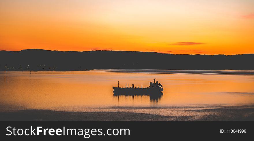 Silhouette Photography Of Mountain And Body Of Water