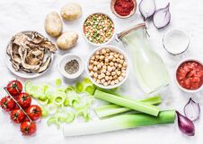 Vegetarian Food Ingredients For Detox Lunch. Soup Ingredients - Chicken Broth, Celery, Leeks, Lentils, Chickpeas, Tomatoes, Red On Stock Photo