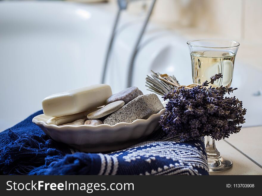 Lavender Flowers, Towel, Bathroom Accessories And A Glass Of White Wine - Home Spa