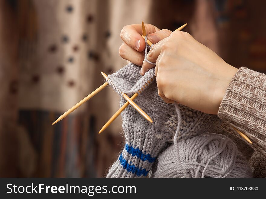 Hands Of Woman Knitting A Sock
