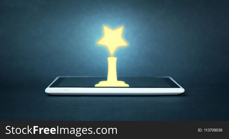 Golden Award on digital tablet. Success concept
