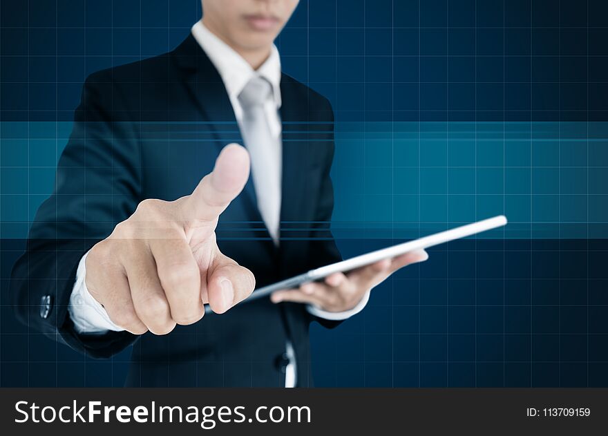 Businessman pressing on virtual screen, with copy space