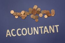 Accountant Written With Wooden Letters On A Blue Background Stock Photo