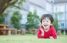 Free Closeup Happy Asian Kid Lied On Grass Floor In The Garden Background With Cute Motion Royalty Free Stock Photos - 113746628