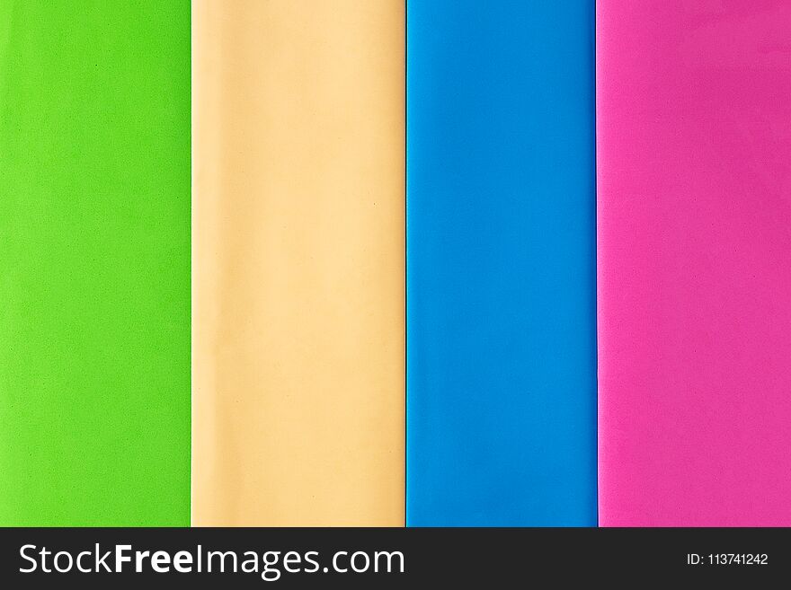 Pastel creative colors paper background, view from above.