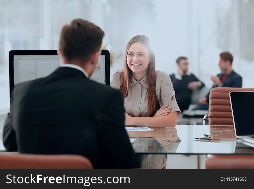 Woman Working With Her Colleague In The Office.