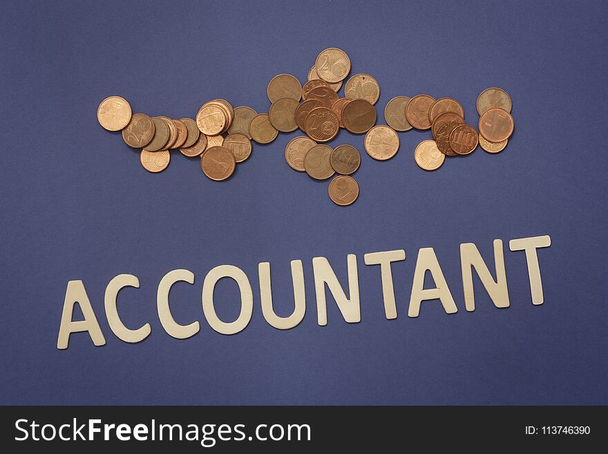 Accountant written with wooden letters on a blue background to mean a business concept