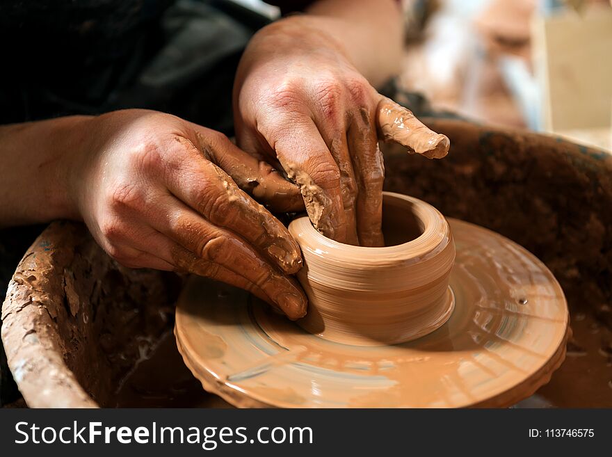 Potter at work. Workshop place.