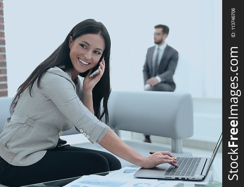 Competent women assistant at her workplace. Photo with copy space. Competent women assistant at her workplace. Photo with copy space