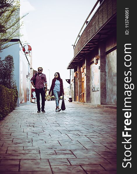 Portrait of hipster couple walking in the street urban. Couple e