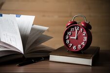 Books And Alarm Clock On Wooden Table. Education Concept. Royalty Free Stock Images