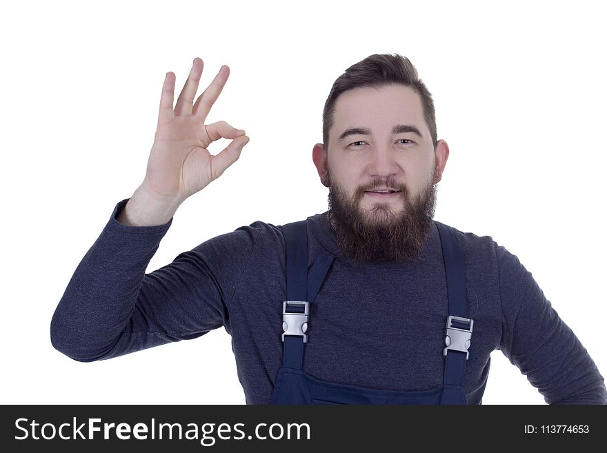 Young Man With A Beard In Overalls