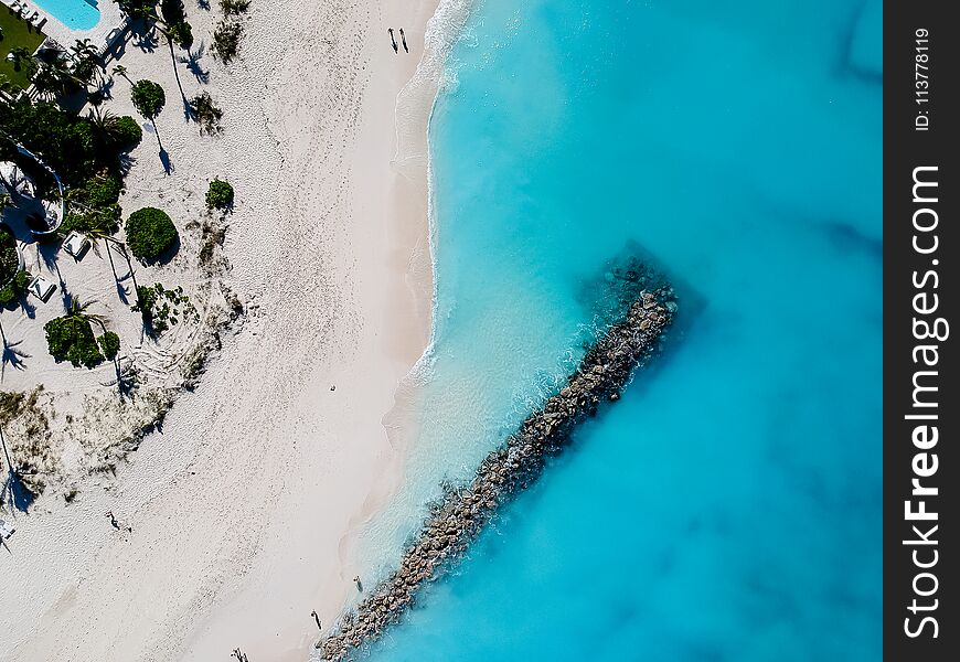Drone photo of beach with red umbrellas in Grace Bay, Providenciales, Turks and Caicos. Drone photo of beach with red umbrellas in Grace Bay, Providenciales, Turks and Caicos.
