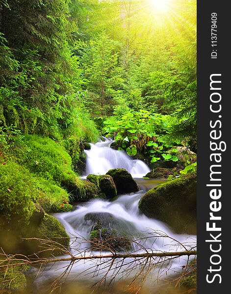 Waterfall on mountain stream in Czech Republic.