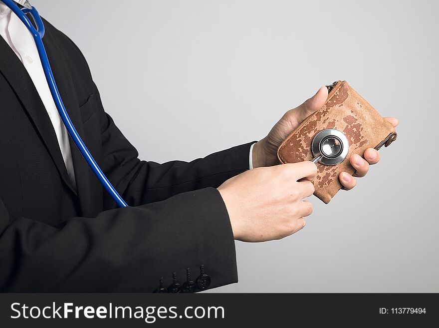 Man using stethoscope for wallet