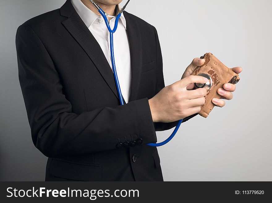 Man Using Stethoscope For Wallet