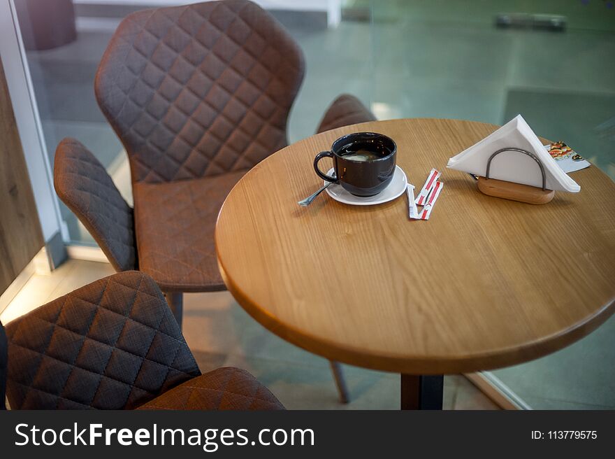 Wooden table, chairs, tea bag and sugar sticks in cafe. Wooden table, chairs, tea bag and sugar sticks in cafe