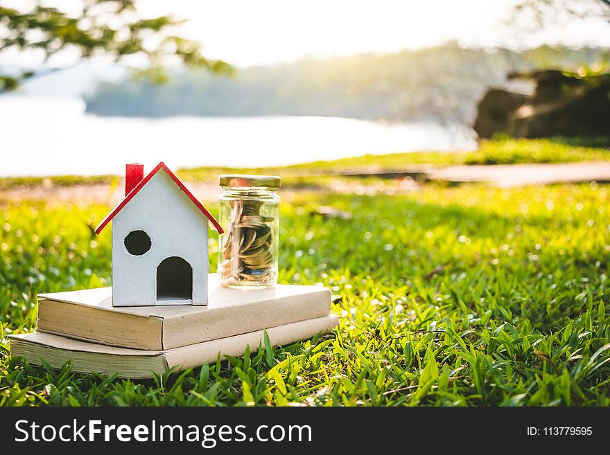 House on the grass in nature, Concept Investment in real estate finance. House on the grass in nature, Concept Investment in real estate finance.