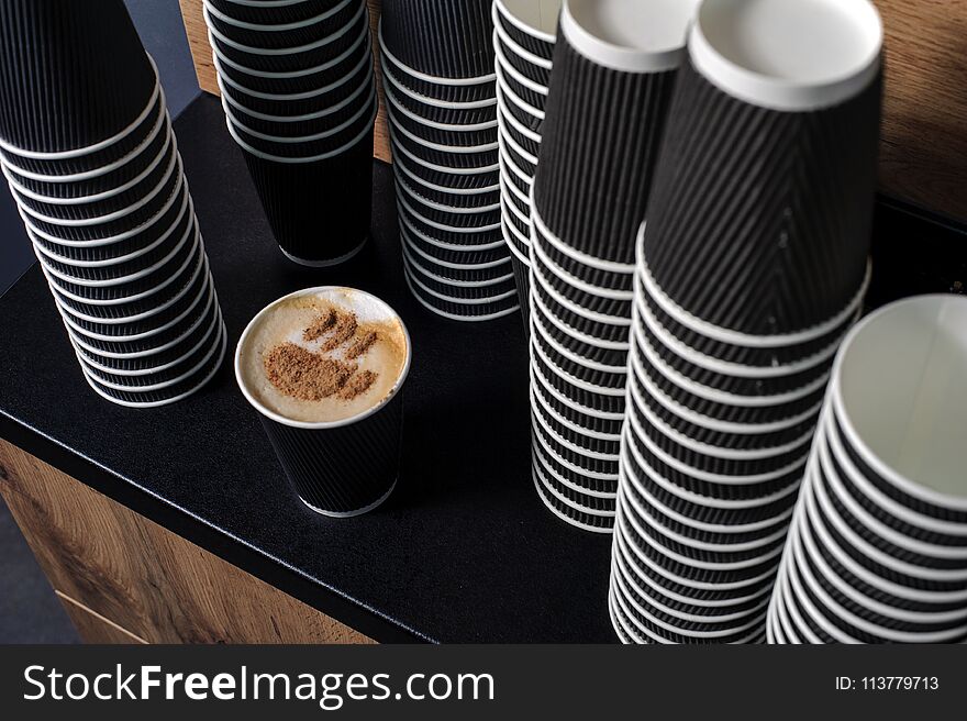 Many grey paper fast food disposable coffee cups