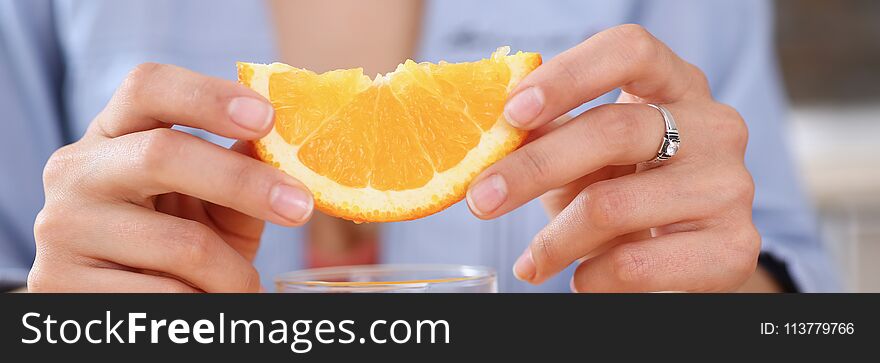 Female Arms Hold Slides Orange And Glass Of Juice