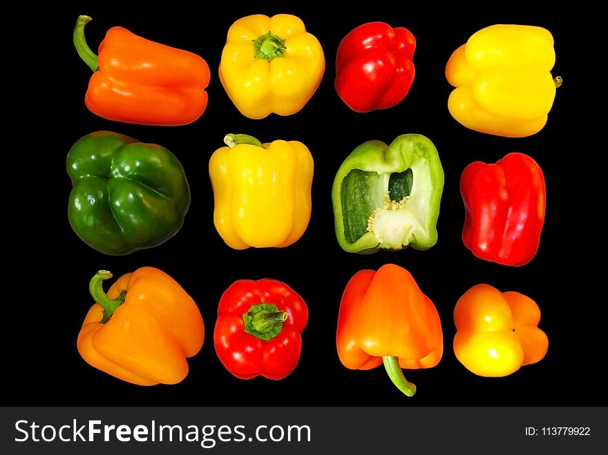 Rainbow pepper with multiple colors green, yellow, red, orange colors isolated on a black background. Rainbow peppers or chili are common vegetables for sale in the supermarket. Rainbow pepper with multiple colors green, yellow, red, orange colors isolated on a black background. Rainbow peppers or chili are common vegetables for sale in the supermarket.